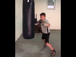 evaluate the work on the bag of a young boxer