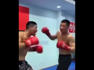 chinese boxers exercising cast-iron heads