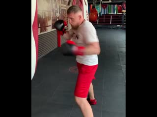 silovik dmitry kudryashov works on a heavy bag