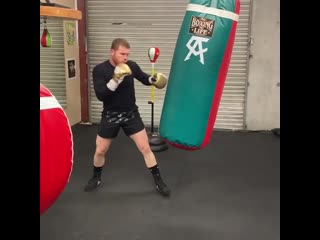 canelo alvarez works on a heavy bag in quarantine