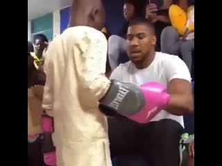 anthony joshua visits underprivileged teen in nigeria