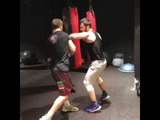 boxing training with an opponent on defense