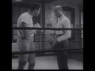 coach teaches muhammad ali boxing balance.