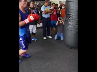 old manny pacquiao strength training on a heavy bag