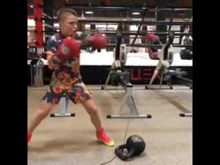 masterwork of a young boxer on a boxing simulator