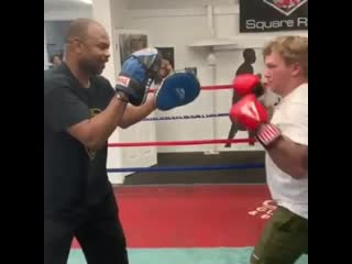 roy jones held a young boy on his paws