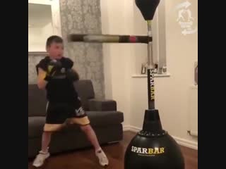 masterwork of a young boxer on a simulator