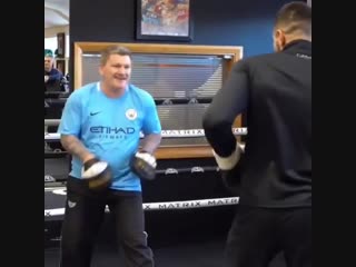 ricky hatton holding his student tommy fury on his paws