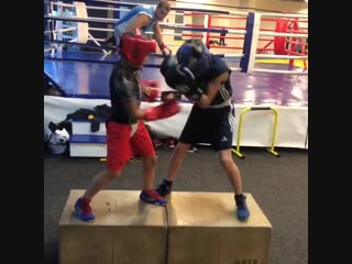 fight training in a telephone booth. when a girl trains boys