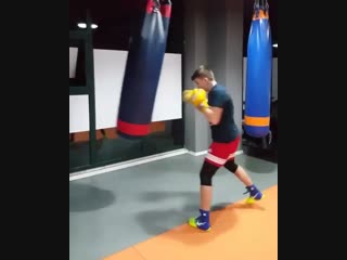 masterwork of a young boxer on a heavy bag