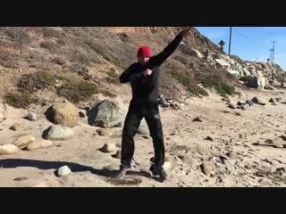 training with stones by sergey kovalev on the ocean.