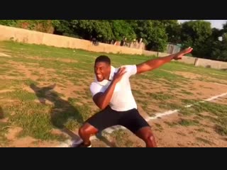 anthony joshua with african teen playing football).