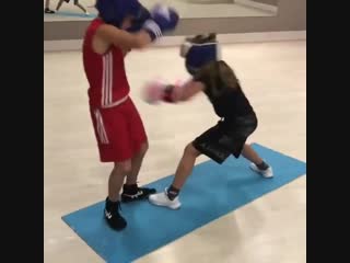 practicing close combat by promising ukrainian boxer kira makogonenko.