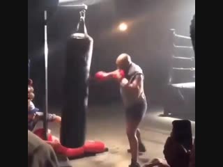 mike tyson is working on a heavy bag at 51 years old.