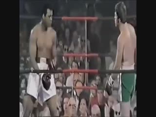 muhammad ali fooling around in the ring.