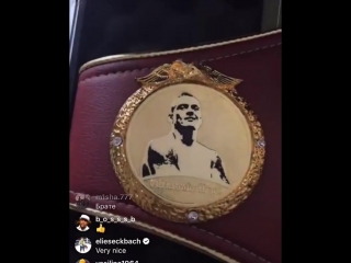 oleksandr usyk cannot stop admiring his belts).