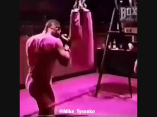 power work mike tyson on a heavy bag.