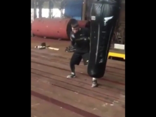 ruslan provodnikov works on a heavy bag at a metallurgical plant.