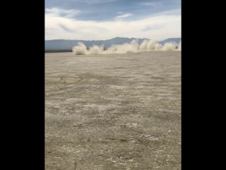 vasily lomachenko drives a porsche on one of the dry lakes in california.