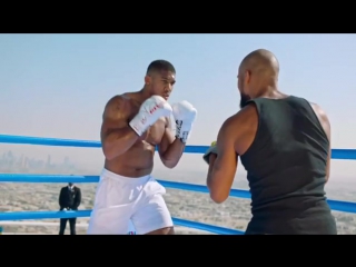 anthony joshua in dubai on the roof of a skyscraper.