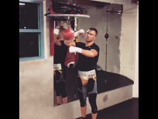 uncle vasya lomachenko is preparing for a fight with rigondeaux on a pneumatic bag.