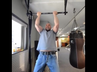 dana white shakes the bitsunya on the horizontal bar.