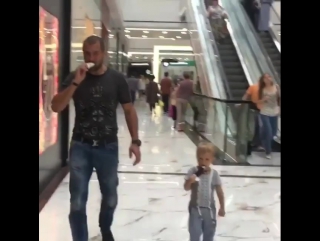 sergey kovalev's walk with his son through the store.